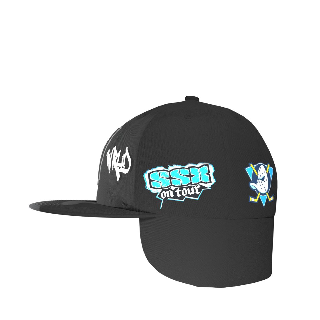 Side view of Negativ Down Flap Cap – embroidered NGTV World graffiti logo with winter-ready fur details.
